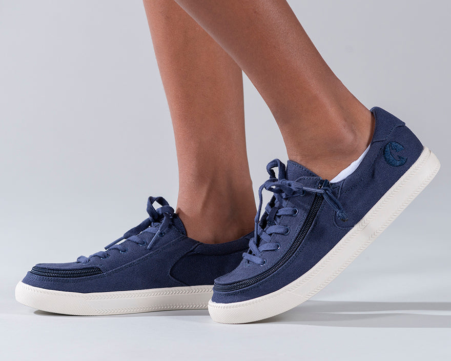Kid's Navy BILLY Sustainable Lace Lows, zipper shoes, like velcro, that are adaptive, accessible, inclusive and use universal design to accommodate an afo. BILLY Footwear has medium and wide width, M, D and EEE, are comfortable, and come in toddler, kids, mens, and womens sizing.
