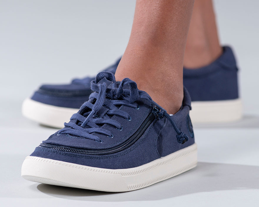 Kid's Navy BILLY Sustainable Lace Lows, zipper shoes, like velcro, that are adaptive, accessible, inclusive and use universal design to accommodate an afo. BILLY Footwear has medium and wide width, M, D and EEE, are comfortable, and come in toddler, kids, mens, and womens sizing.