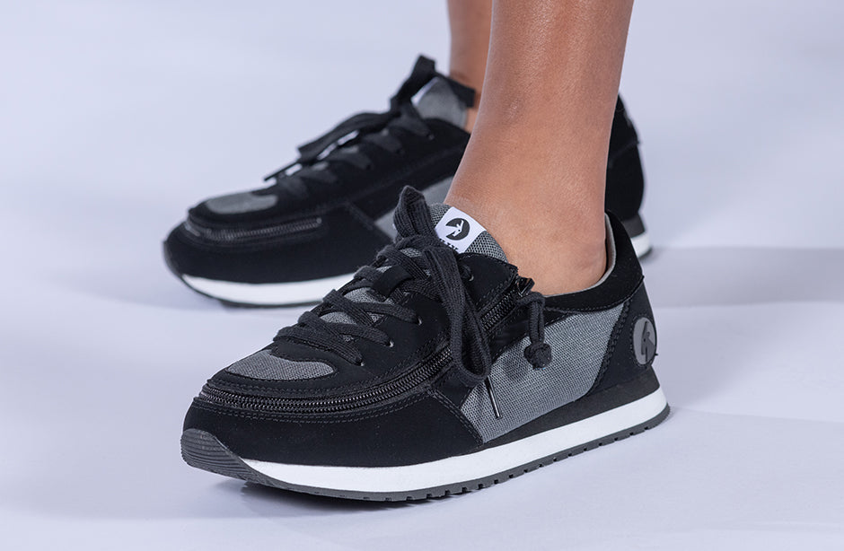 Kid's Black/Charcoal BILLY Joggers, zipper shoes, like velcro, that are adaptive, accessible, inclusive and use universal design to accommodate an afo. BILLY Footwear is medium and wide width, M, D and EEE, are comfortable, and come in toddler, kids, mens, and womens sizing.