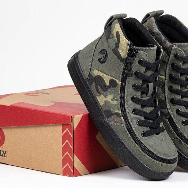 Kid's Olive Camo BILLY Street High Tops, zipper shoes, like velcro, that are adaptive, accessible, inclusive and use universal design to accommodate an afo. BILLY Footwear comes in medium and wide width, M, D and EEE, are comfortable, and come in toddler, kids, mens, and womens sizing.
