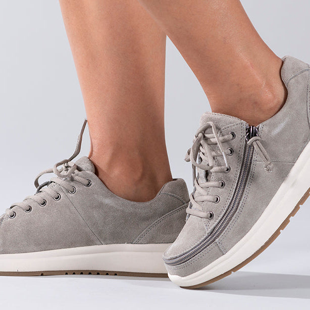 Women's Grey Suede BILLY Comfort Lows, zipper shoes, like velcro, that are adaptive, accessible, inclusive and use universal design to accommodate an afo. Footwear is medium and wide width, M, D and EEE, are comfortable, and come in toddler, kids, mens, and womens sizing.