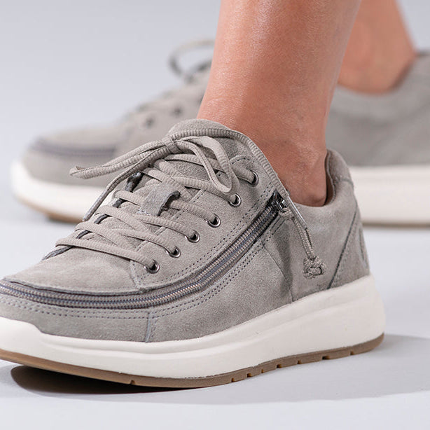 Women's Grey Suede BILLY Comfort Lows, zipper shoes, like velcro, that are adaptive, accessible, inclusive and use universal design to accommodate an afo. Footwear is medium and wide width, M, D and EEE, are comfortable, and come in toddler, kids, mens, and womens sizing.