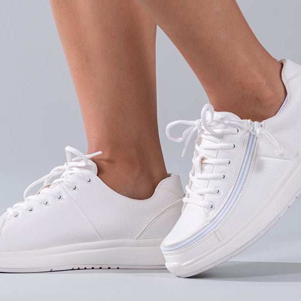 Women's White BILLY Work Comfort Lows, zipper shoes, like velcro, that are adaptive, accessible, inclusive and use universal design to accommodate an afo. Footwear is medium and wide width, M, D and EEE, are comfortable, and come in toddler, kids, mens, and womens sizing.